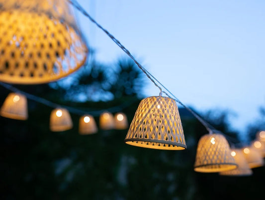 Outdoor LED string lights with 16 bamboo shades, 4.5m long. Plug and transformer are included.